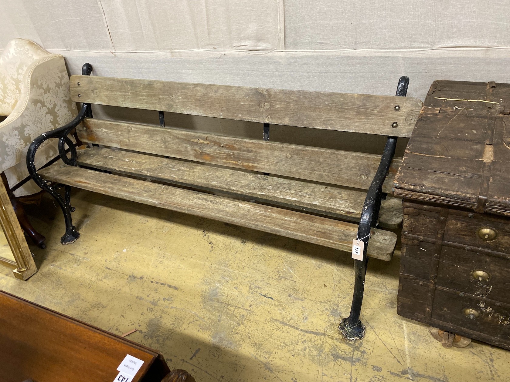 A Victorian painted cast iron slatted garden bench, length 180cm, depth 56cm, height 82cm